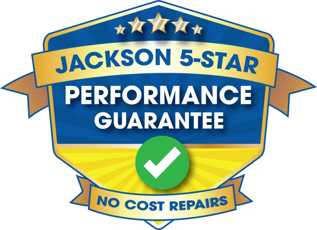 A Blue And Gold Badge With Stars And Banners Reads &Quot;Jackson 5-Star Performance Guarantee&Quot; And &Quot;No Cost Repairs&Quot; With A Green Checkmark In The Center.